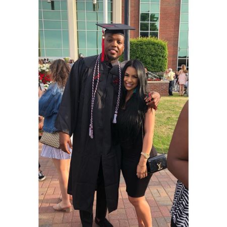 adrianna rivas with her husband derrick henry at graduation