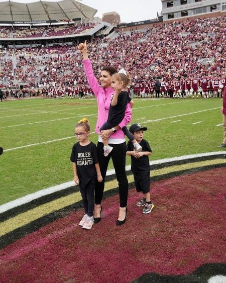 casey desantis with her three children at nfl ground