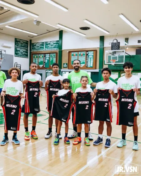 gabe vincent providing training to younger kids on basketball