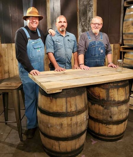 mark ramsey with his friends at his distilling factor
